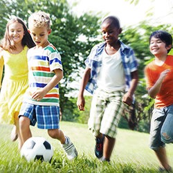 Girls and boys playing soccer